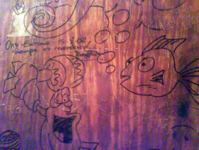 stories of the sea on the door of a bathroom