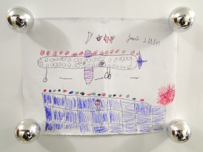 Juani waves good bye to auntie Val, who is at seat 13 L on a LAN Chile flight